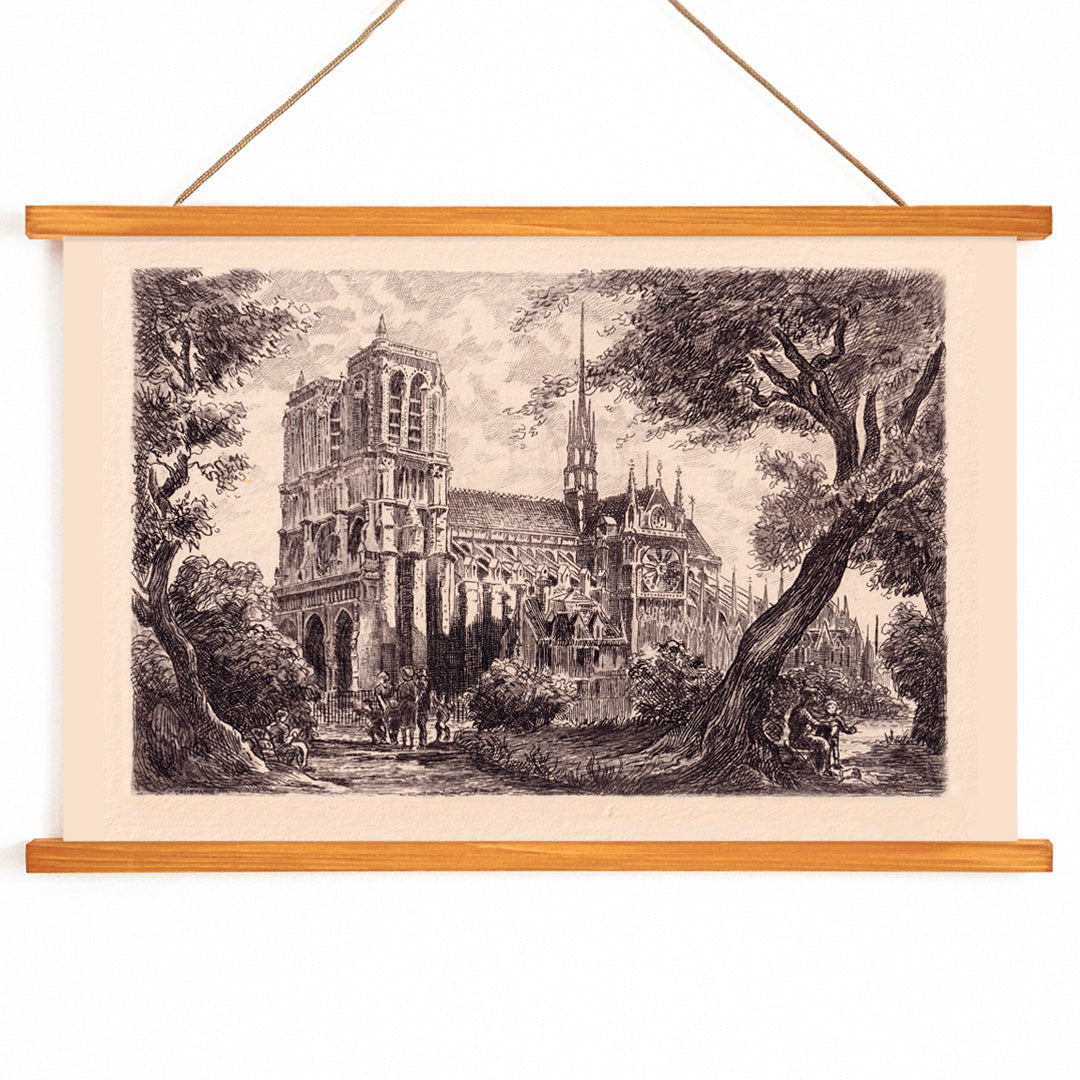 Artistic poster of Notre Dame de Paris cathedral surrounded by trees and people in a scenic landscape, with wooden magnetic frame on white background