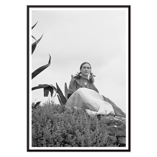 Frida Kahlo and Senora Diego Rivera seated beside agave plant photographed by Toni Frissell poster artwork, with black aluminium frame on white background