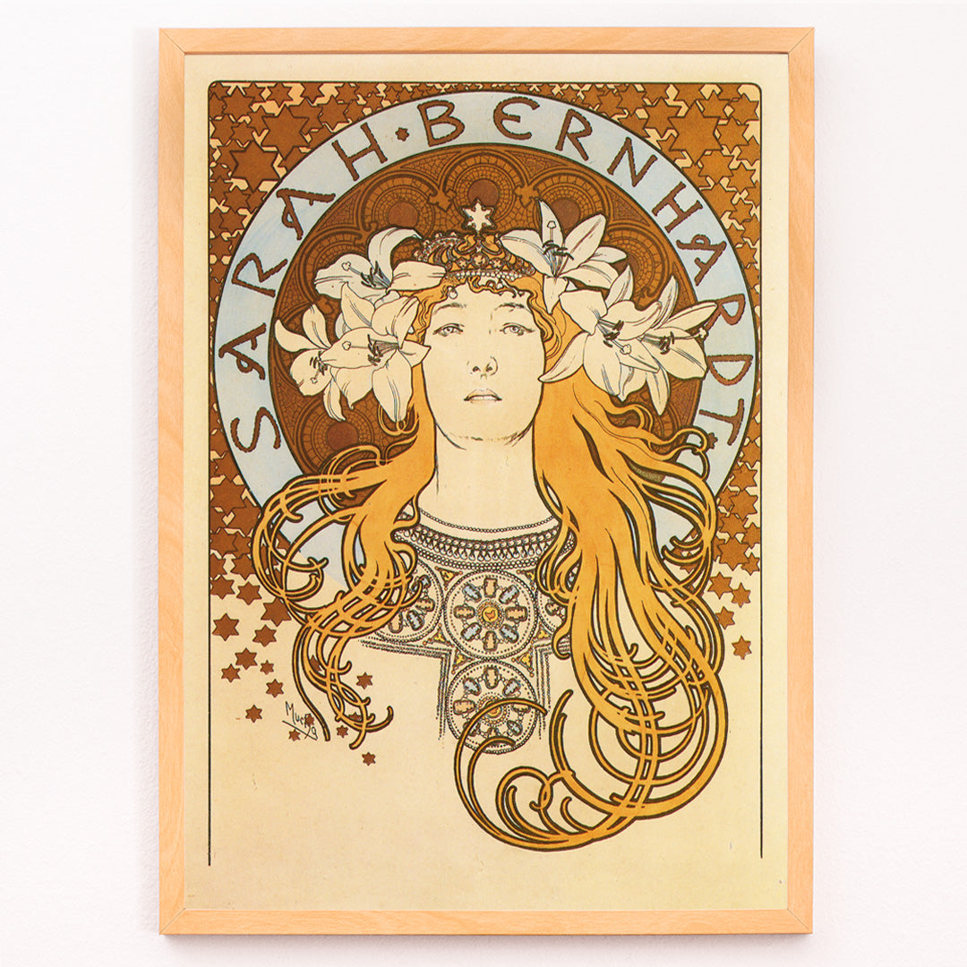 Closeup detail of Art Nouveau poster of Sarah Bernhardt with flowing hair floral crown and lilies by Alphonse Mucha from La Plume