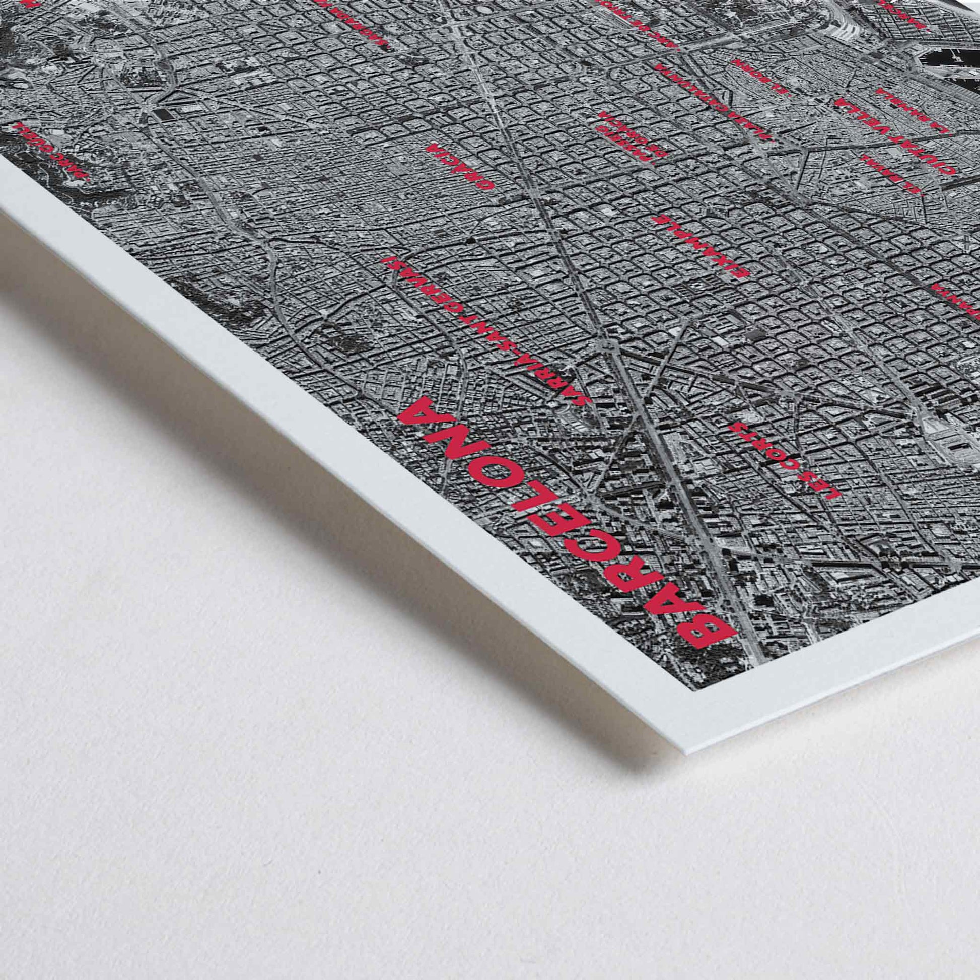 Closeup detail of Moryarty Barcelona satellite city map poster in bold black and white aerial style showing city grid districts landmarks monuments and coastline