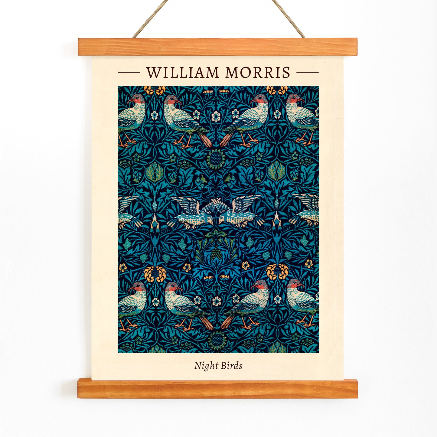 Night Birds by William Morris colorful patterned illustration and poster with intricate birds and floral designs in rich blue and green tones, with wooden magnetic frame on white background