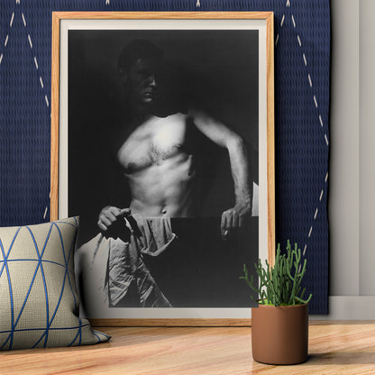 Shirtless man holding towel in dramatic lighting Max After Surfing by Olive Cotton wall art photography poster, framed and displayed in home decor