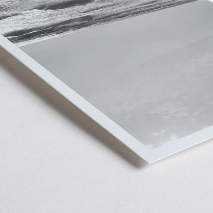 Closeup detail of Black and white poster of a surfer with a board entering the ocean titled Surfer in Portugal by artist Black