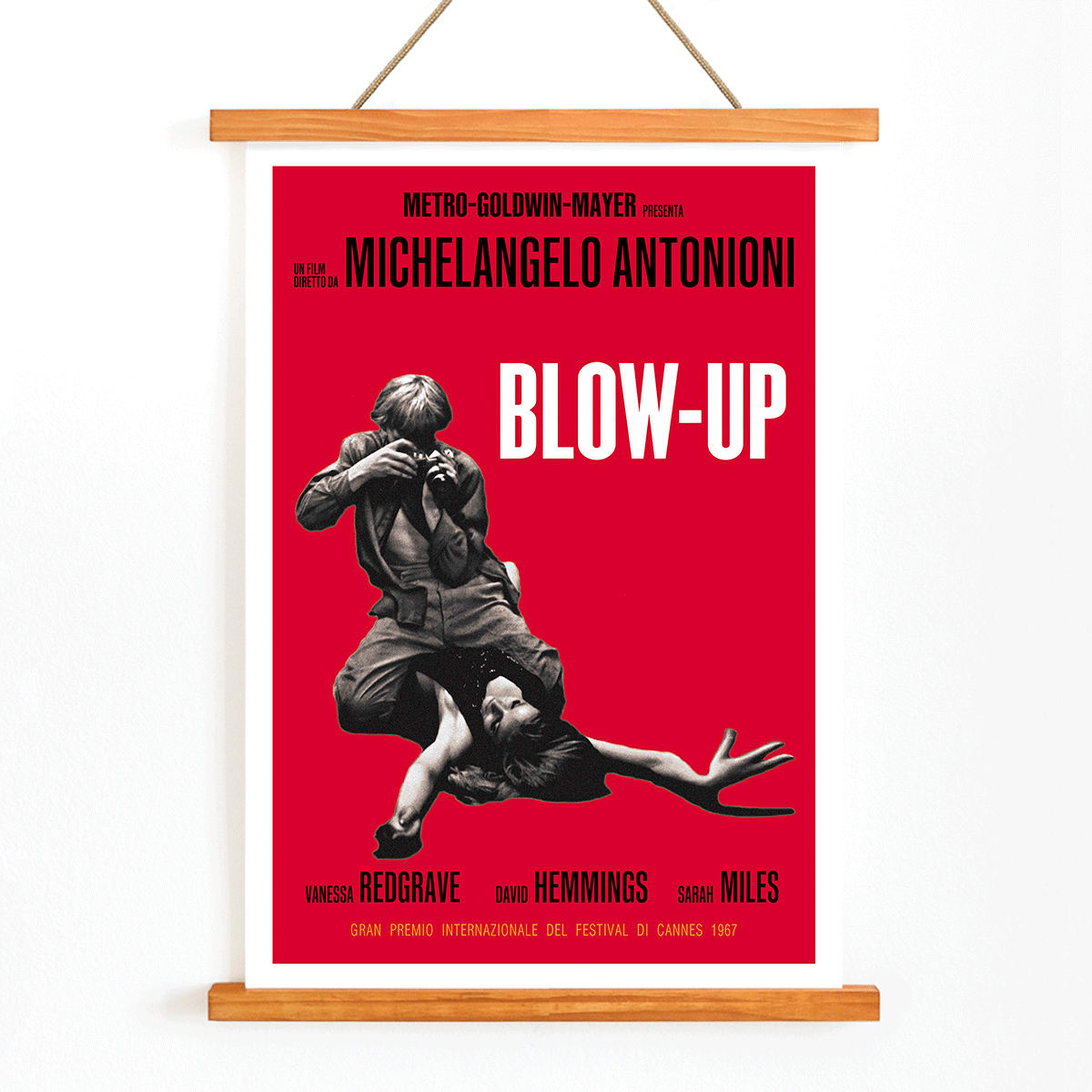 Michelangelo Antonioni Blow Up Movie poster with dramatic black and white photography and vibrant red background, with wooden magnetic frame on white background