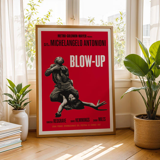 Michelangelo Antonioni Blow Up Movie poster with dramatic black and white photography and vibrant red background, framed and displayed in home decor