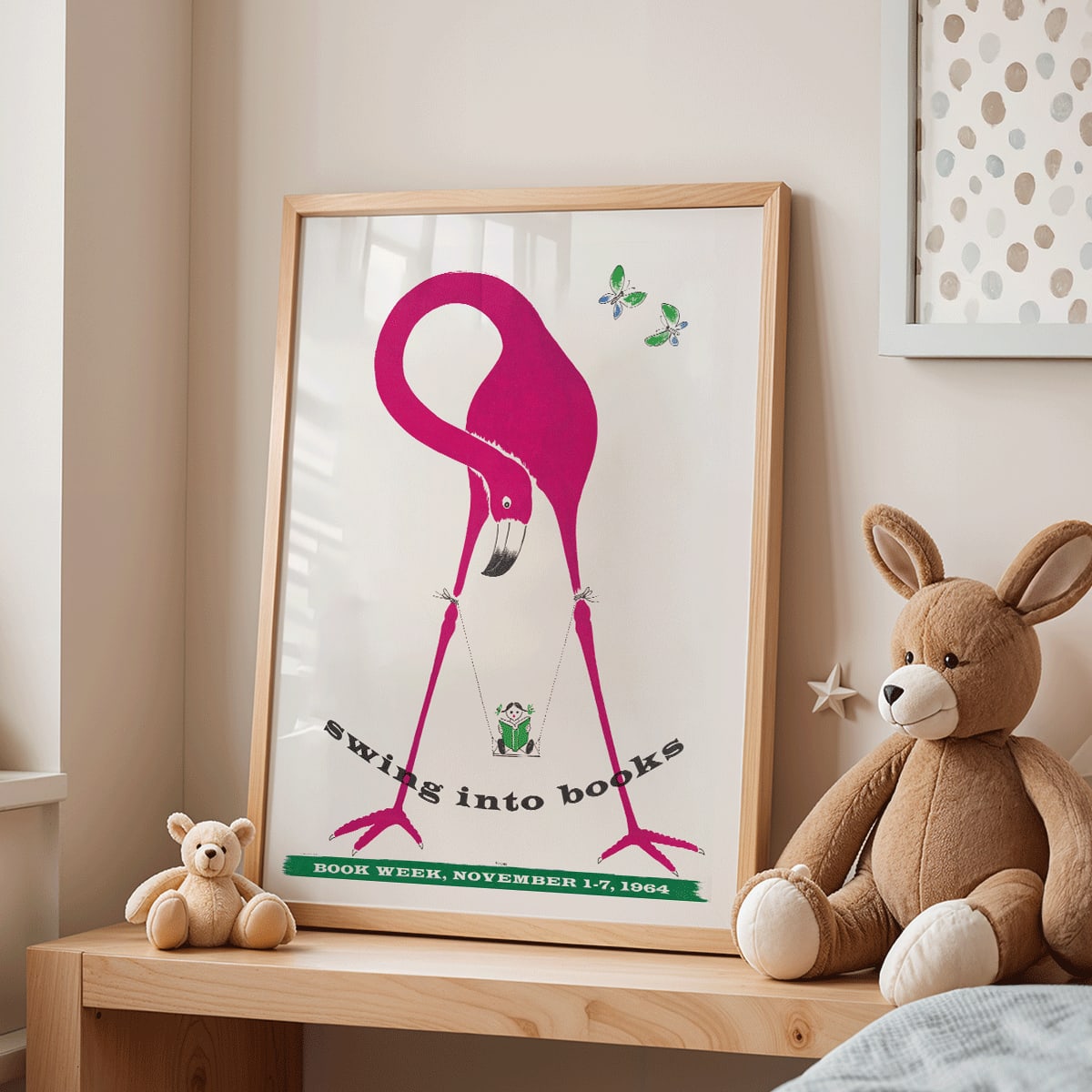 Pink flamingo holding a swinging book with butterflies and a monkey art poster titled Swing into Books, framed and displayed in home decor