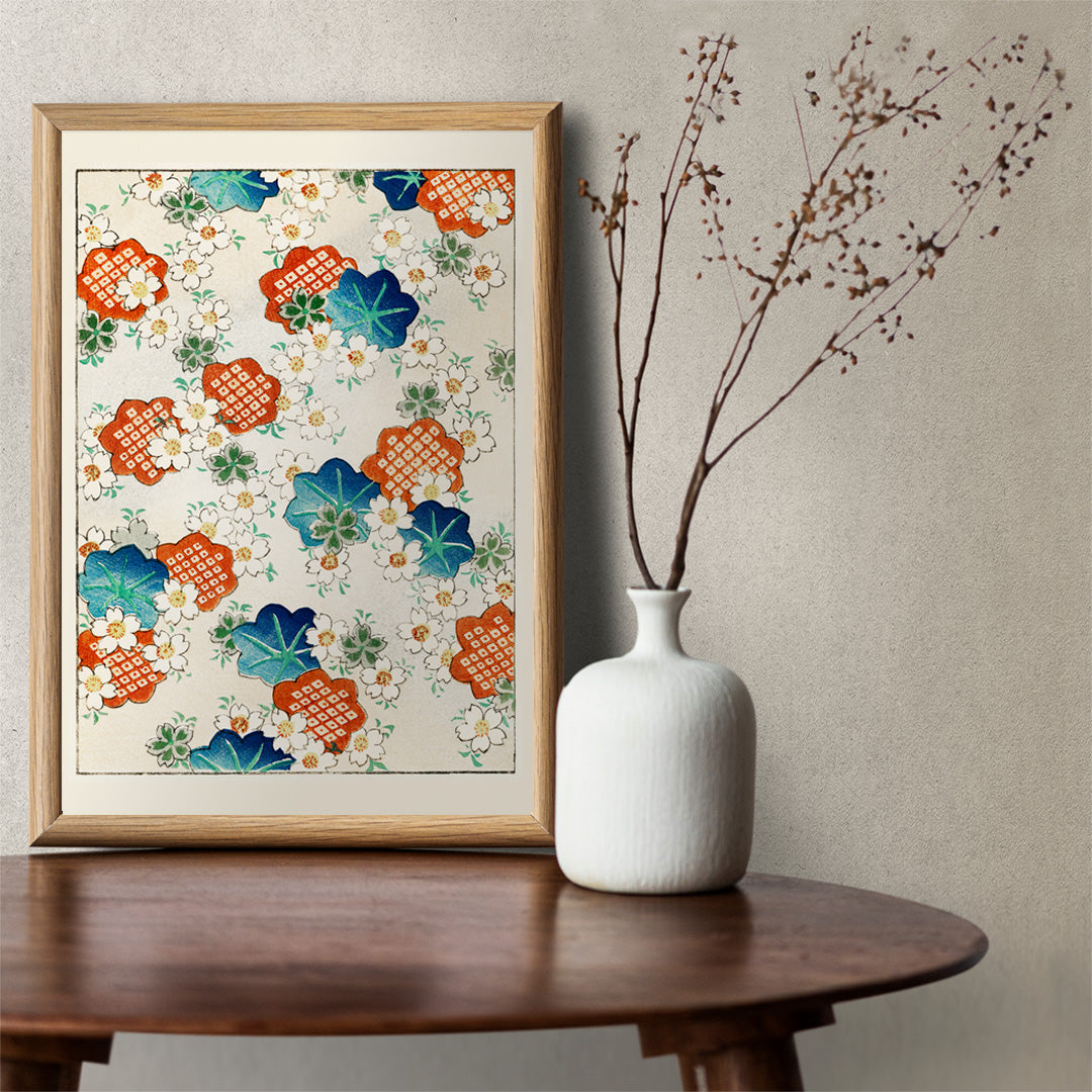 Colorful floral pattern artwork by Watanabe Seitei from Bijutsu Sekai featuring traditional Japanese design with colorful blossoms and leaves on a light background, framed and displayed in home decor