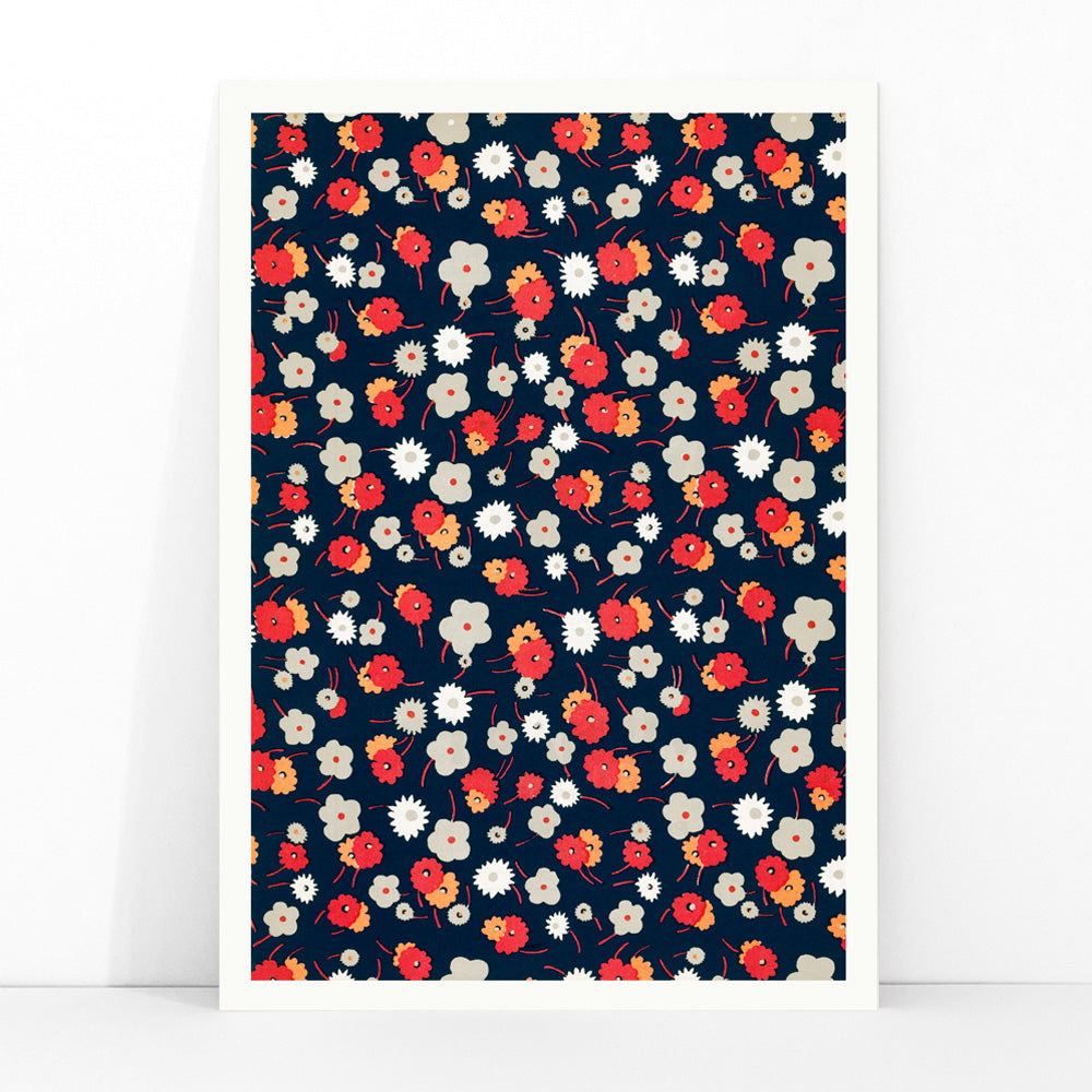 Colorful floral pattern poster with white gray pink and red flowers on dark background by Charles Goy, framed and displayed in modern living room decor