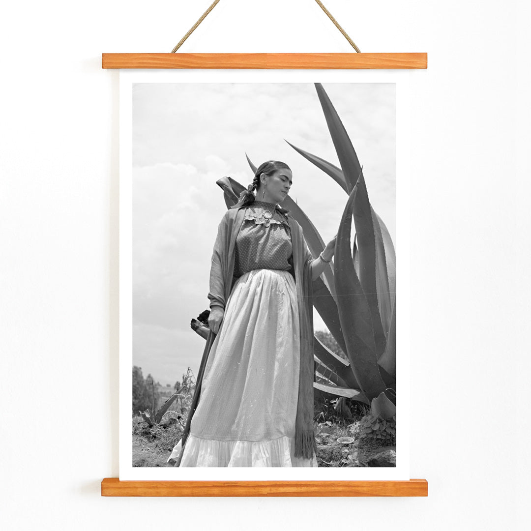 Frida Kahlo standing by agave plant black and white photograph and poster by Toni Frissell titled Senora Diego Rivera, with wooden magnetic frame on white background