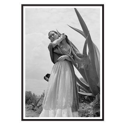 Frida Kahlo Senora Diego Rivera standing beside agave plant by Toni Frissell black and white artwork poster, with black aluminium frame on white background