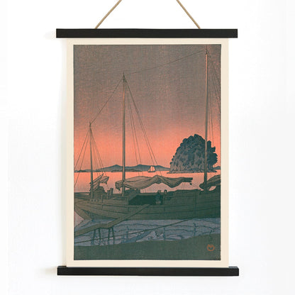 Ukiyo e Harbour Sunset by Kawase Hasui with boats docked at sunset tranquil evening sky island and mountains in background, with wooden magnetic frame on white background