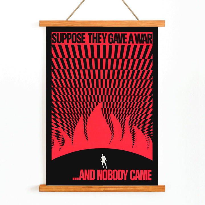Man on hill facing flames poster by Gary Yanker titled Suppose They Gave a War and Nobody Came Prop art New York, with wooden magnetic frame on white background