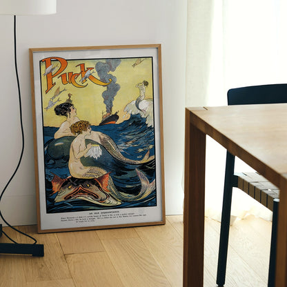 Vintage Puck Magazine illustration of mermaids sewing in a vibrant ocean scene with a boat in the background by Louis M Glackens and anonymous artist, framed and displayed in modern living room decor