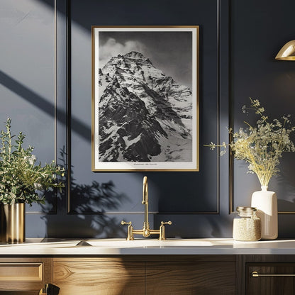 Black and white photograph and poster of K2 west face by Vittorio Sella showing the snow-covered mountain peak, framed and displayed in home decor