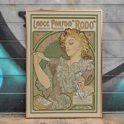 Alphonse Mucha Lance parfum Rodo poster Art Nouveau woman with flowing hair floral border soft green gold tones, framed and displayed in home decor