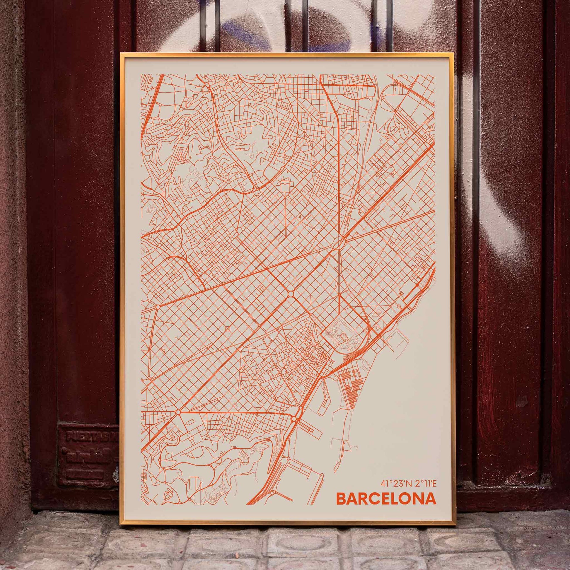 Minimalist map of Barcelona by Moryarty featuring red lines on a beige background poster, framed and displayed in home decor