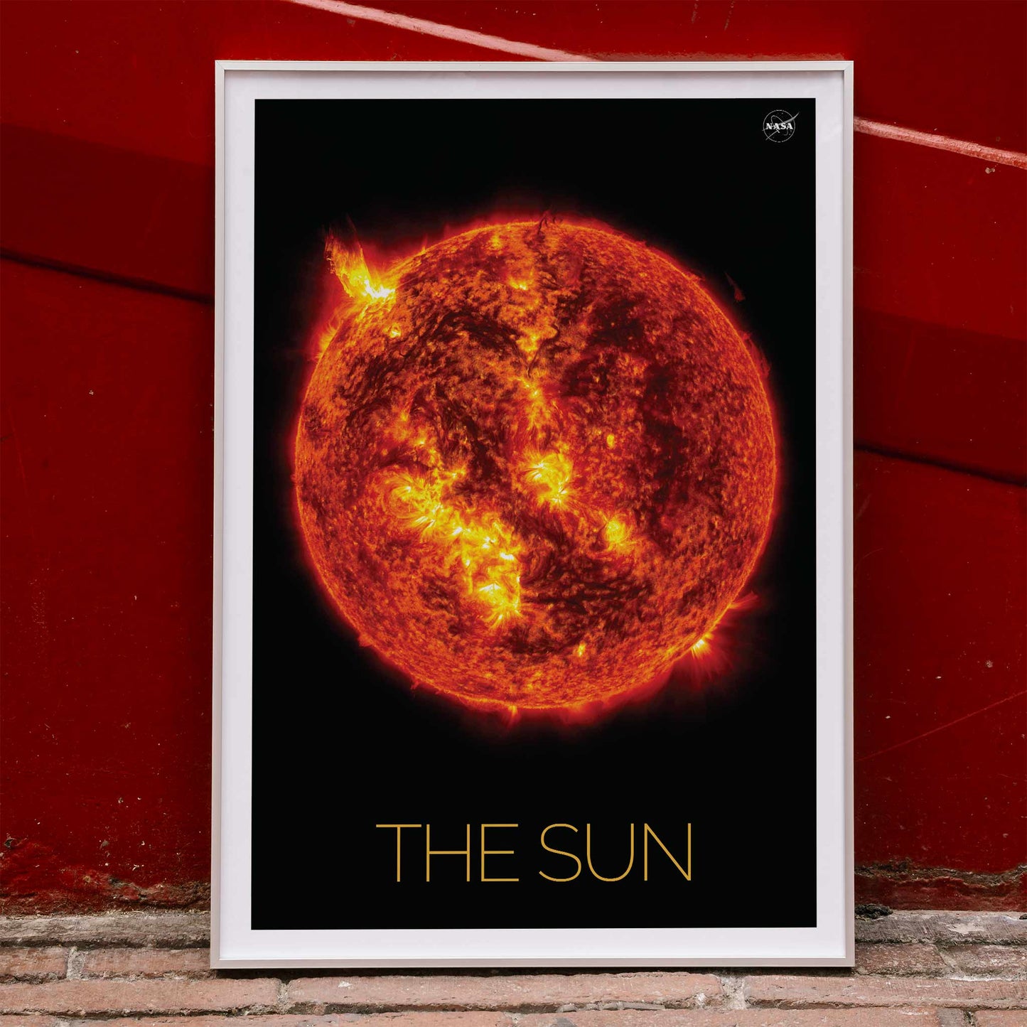 Fiery image of the Sun with solar flares by NASA poster featuring detailed solar activity, framed and displayed in home decor