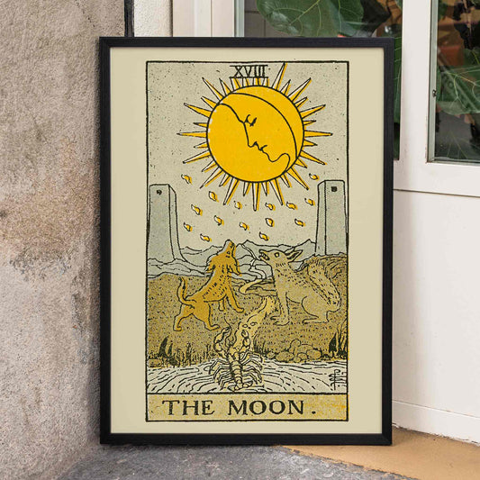 The Moon tarot card by Lauron William de Laurence featuring sun animals and dogs howling at a moon with a face, framed and displayed in home decor
