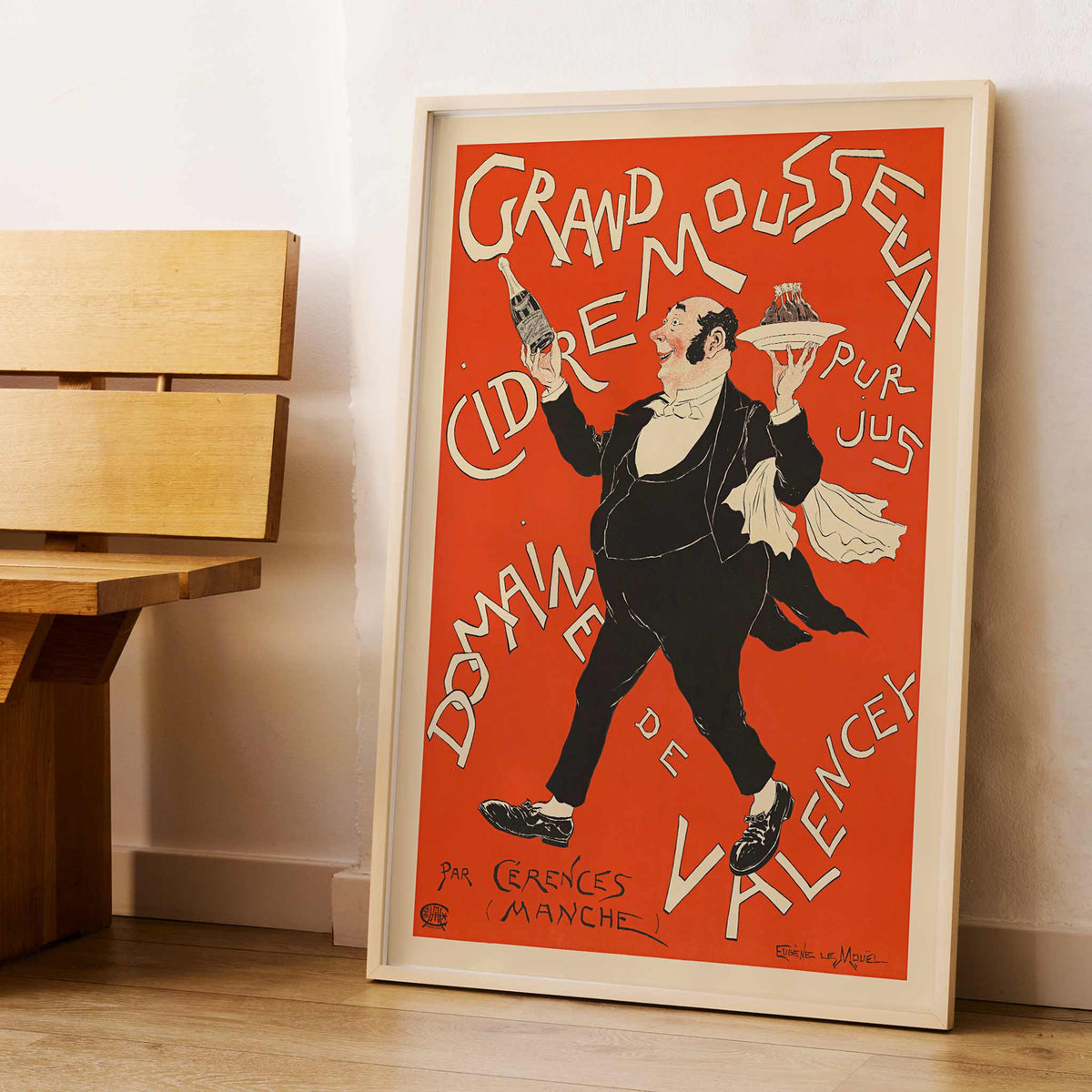 Eugène Le Mouel Grand sparkling cider poster with waiter, bottle and tray in lively red and cream advertising scene, framed and displayed in modern living room decor