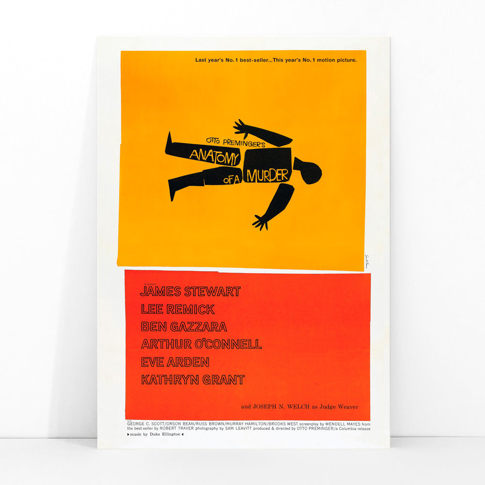 Movie poster of Anatomy of a Murder by Saul Bass features a yellow and red design with a black silhouette of a body, framed and displayed in modern living room decor