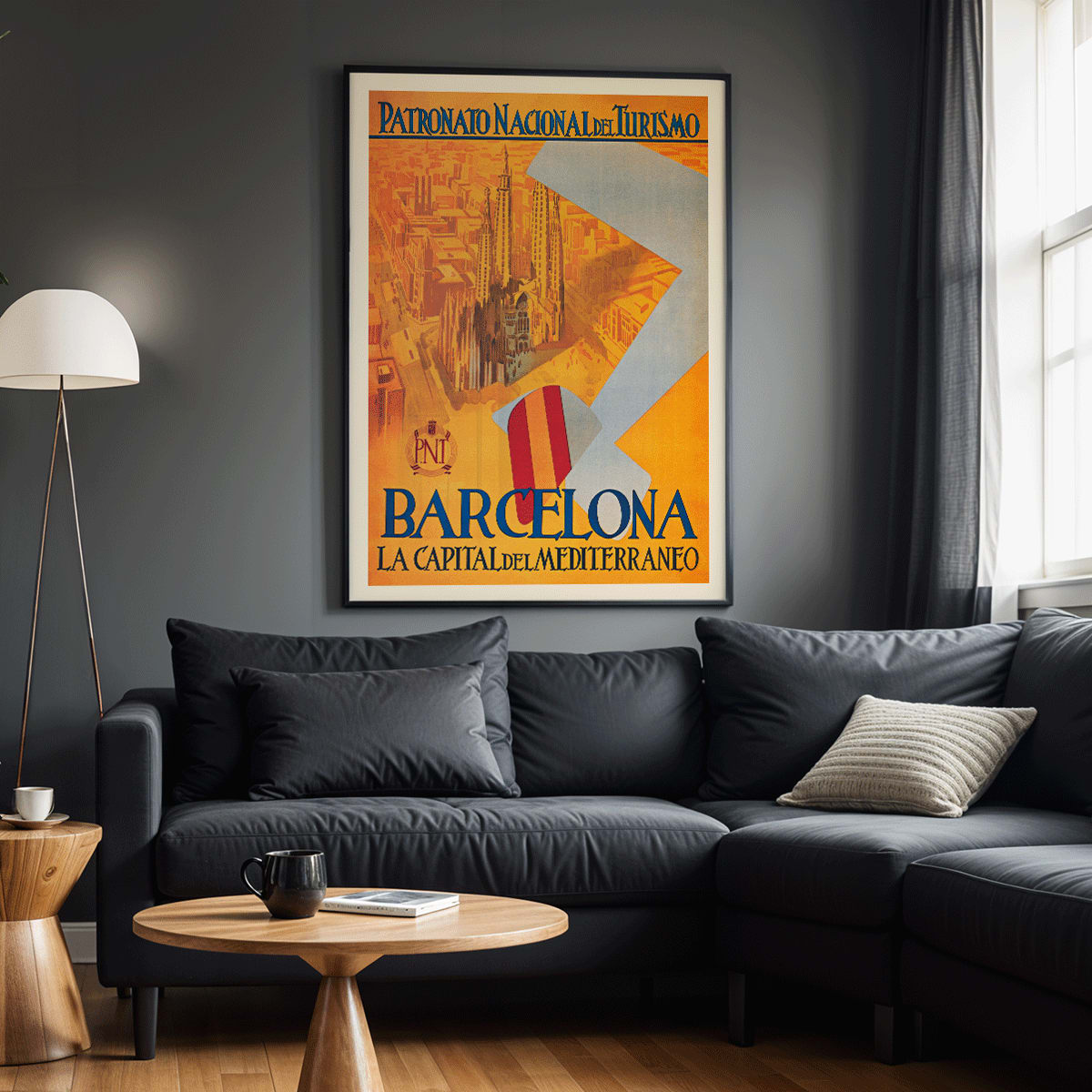 Barcelona La Capital del Mediterraneo poster by Patronato Nacional del Turismo featuring city skyline cathedral cityscape and flying flag, framed and displayed in modern living room decor