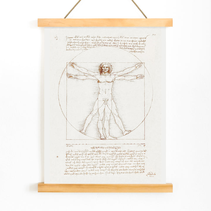 Vitruvian Man by Leonardo da Vinci human figure anatomical study with outstretched arms and legs inside circle and square geometric shapes artwork poster, with wooden magnetic frame on white background