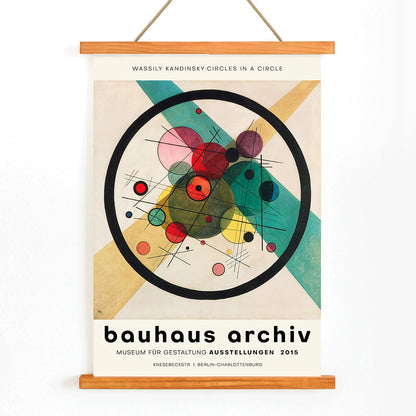 Wassily Kandinsky Circles in a Circle Bauhaus poster featuring abstract geometric shapes circles and lines for Bauhaus Archiv exhibition, with wooden magnetic frame on white background