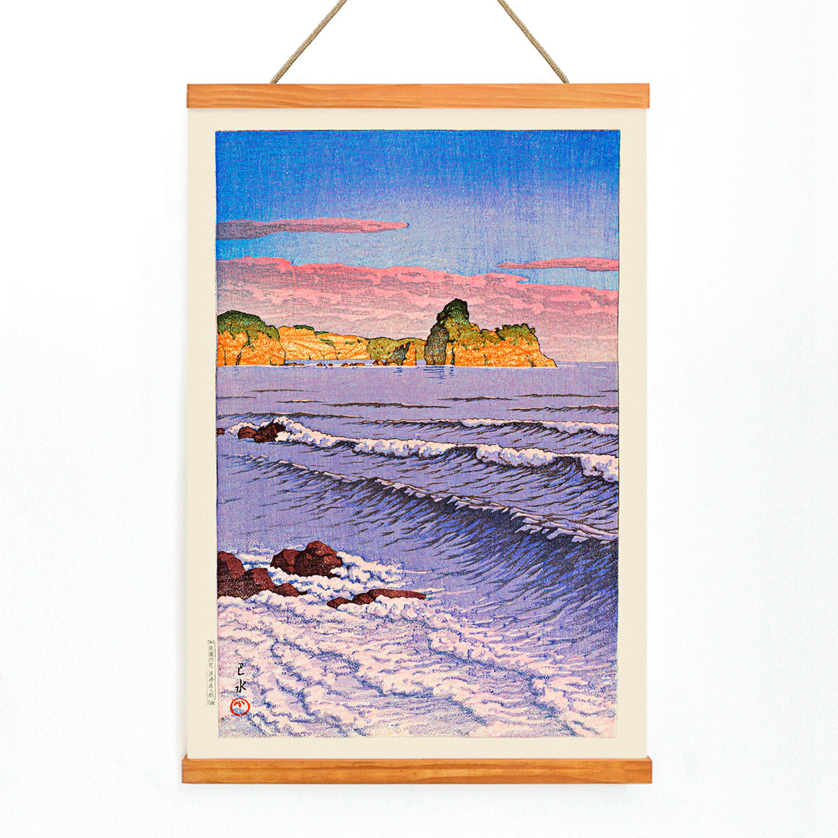 Colorful seascape waves and rocky shore with ocean waves and coastal cliffs in Morning Sea at Bikuni in Shiribeshi Province by Kawase Hasui under a colorful sky, with wooden magnetic frame on white background