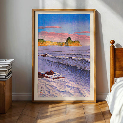 Colorful seascape waves and rocky shore with ocean waves and coastal cliffs in Morning Sea at Bikuni in Shiribeshi Province by Kawase Hasui under a colorful sky, framed and displayed in modern living room decor
